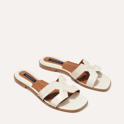 The MX Sandal in Cream, a slip-on sandal featuring croc-embossed Italian calf leather with structured straps and a subtly square toe.