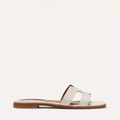 The MX Sandal in Cream, a slip-on sandal featuring croc-embossed Italian calf leather with structured straps and a subtly square toe.