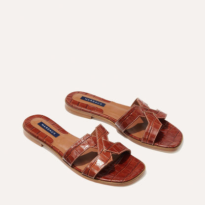 The MX Sandal in Mahogany, a slip-on sandal featuring croc-embossed Italian calf leather with structured straps and a subtly square toe.
