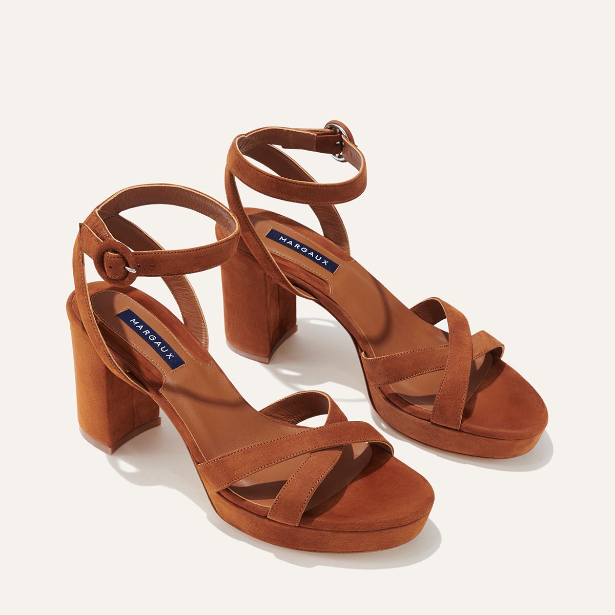 The Platform Sandal in Maple Suede, featuring a sleek ankle strap, perfectly placed straps across the toes and a comfortable 3.5-inch block heel.