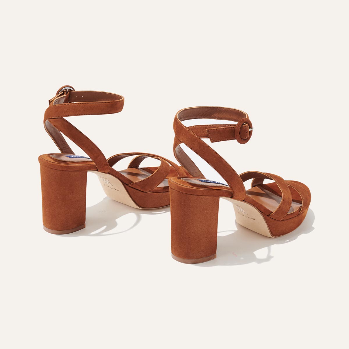 The Platform Sandal in Maple Suede, featuring a sleek ankle strap, perfectly placed straps across the toes and a comfortable 3.5-inch block heel.