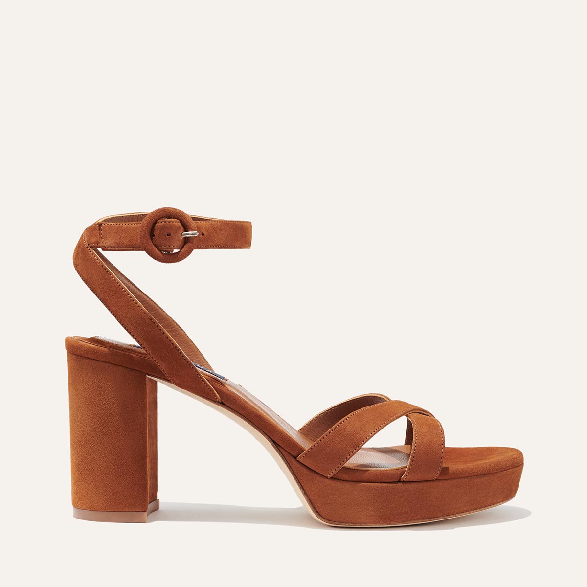 The Platform Sandal in Maple Suede, featuring a sleek ankle strap, perfectly placed straps across the toes and a comfortable 3.5-inch block heel.