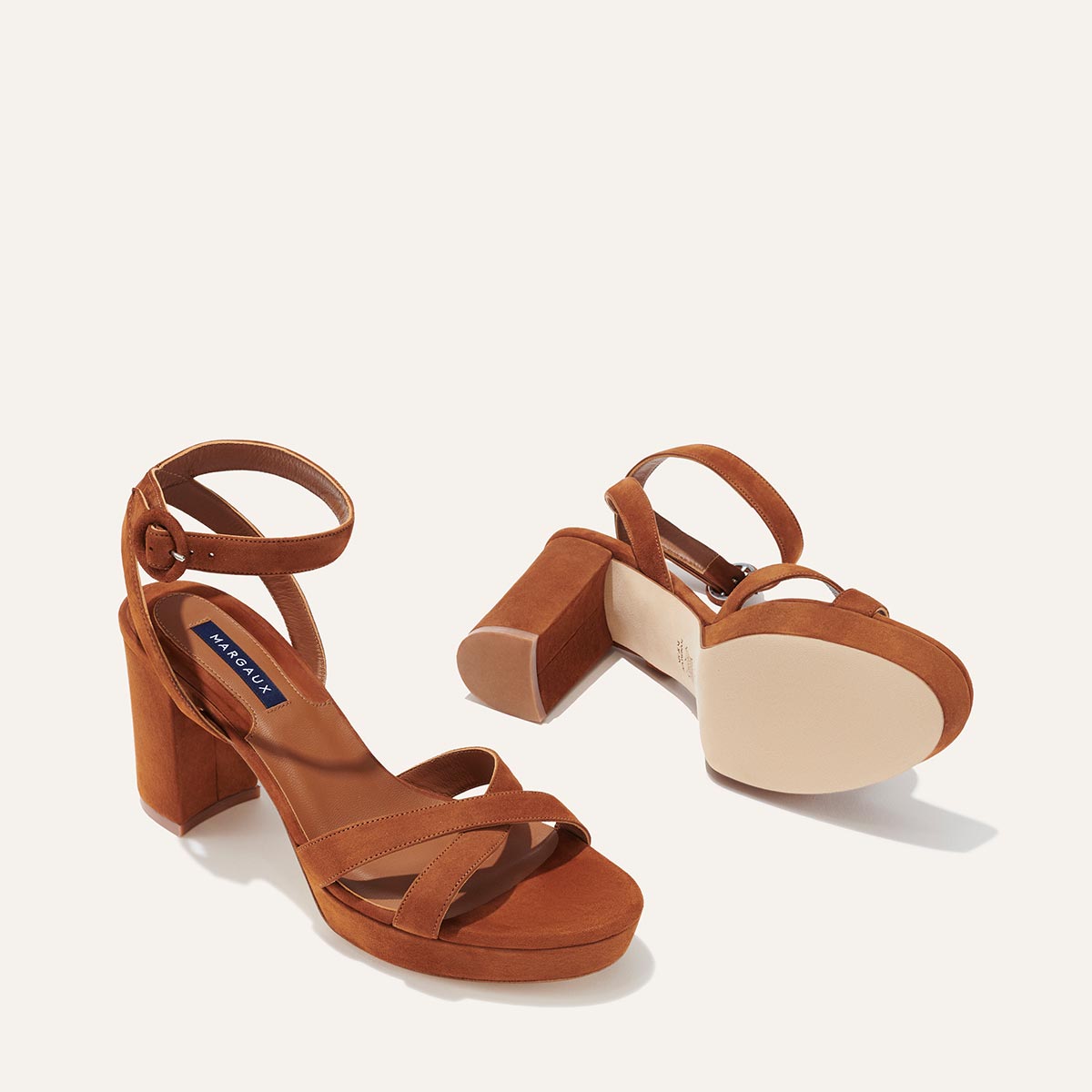 The Platform Sandal in Maple Suede, featuring a sleek ankle strap, perfectly placed straps across the toes and a comfortable 3.5-inch block heel.