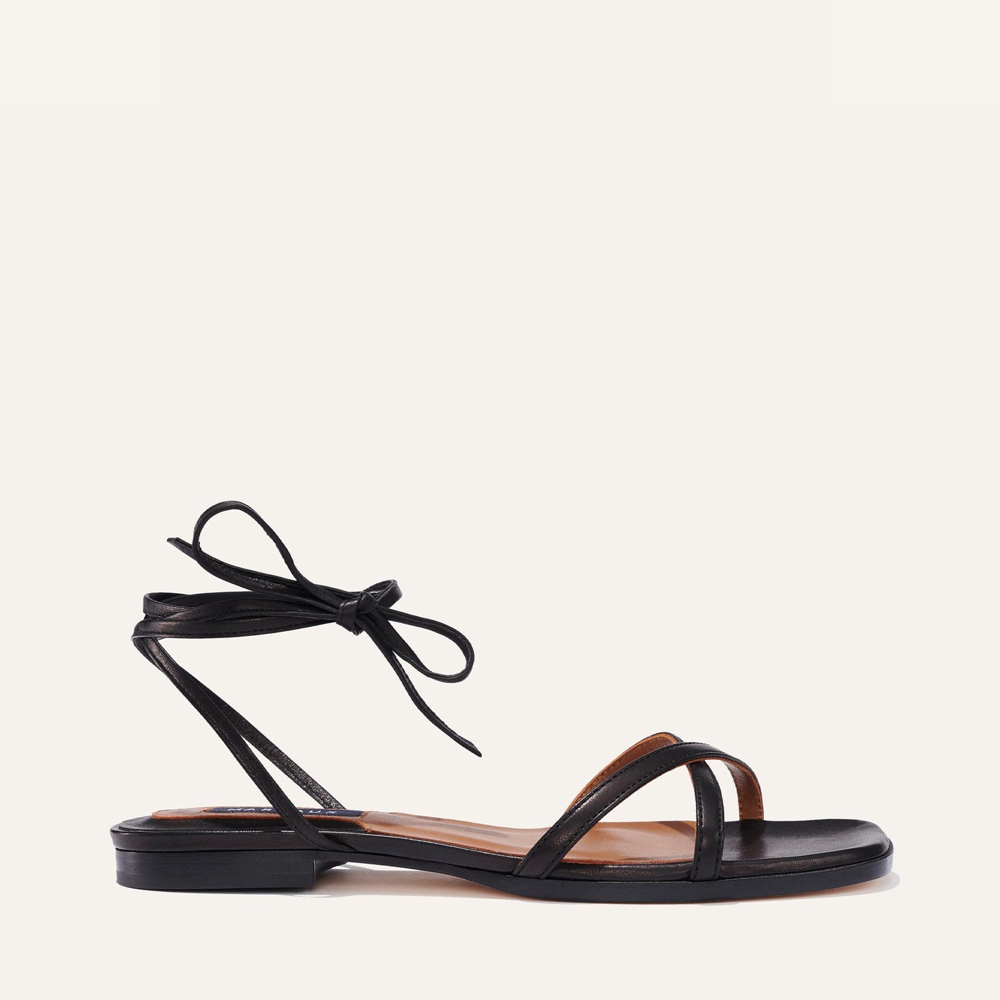 Margaux's classic strappy Wrap Sandal with ankle ties, made in Spain from soft, black Italian nappa leather